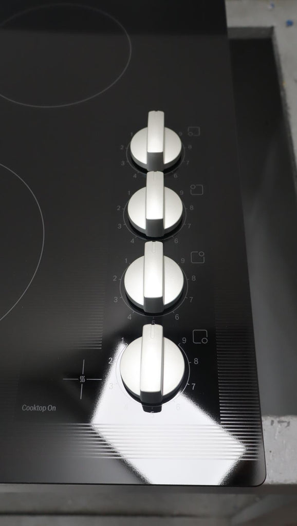 Bosch 24" 500 Series Infinite Temp Control Blk Glass Electric Cooktop NEM5466UC